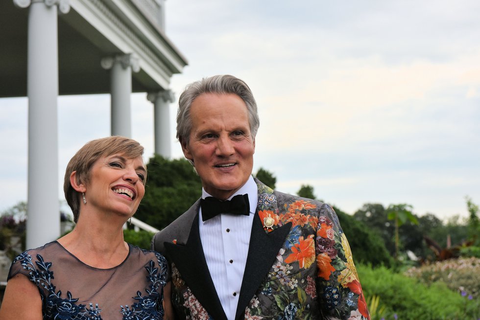 President & CEO of AHS Beth Tuttle and honorary chair Monte Durham greet guests outside the mansion at River Farm..jpg